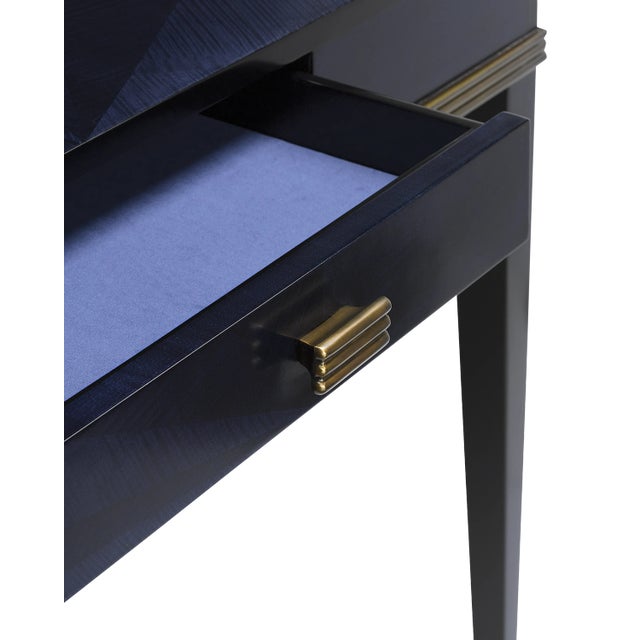 The Kallista Blue Writing Desk has a dark sapphire blue finish that enlivens the sycamore veneers on its top and sides....