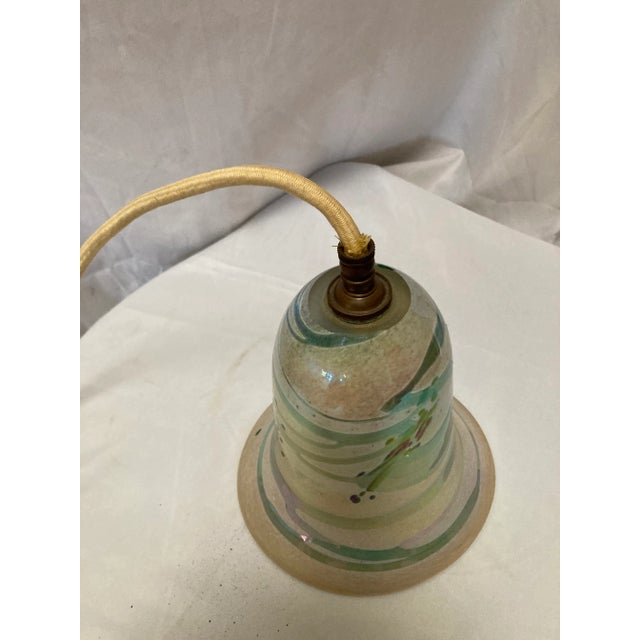 Beautiful antique iridescent art glass pendant lamp. This very unique and one of a kind.