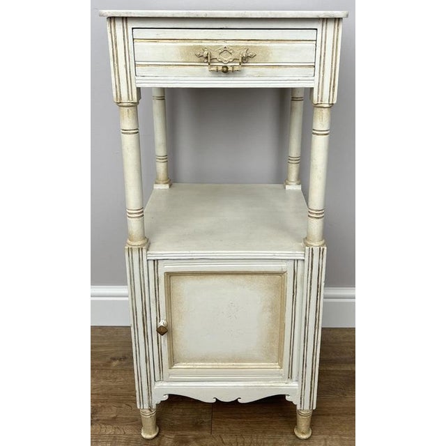 Bring timeless elegance to your home with this Antique marble top bedside table. Featuring a beautiful marble top, classic...