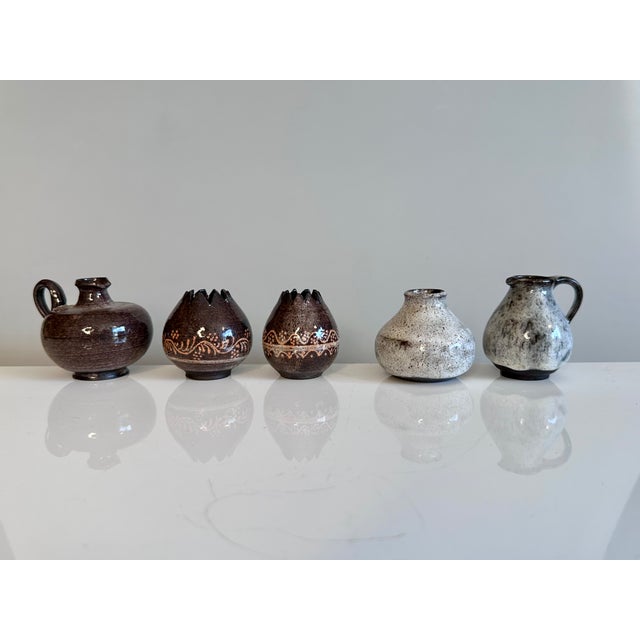 These five handcrafted miniature ceramic vases are unsigned, but each bears the unmistakable signature of the Serocka...