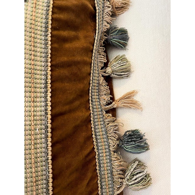 This pillow is hand-made from an antique Aubusson tapestry. It is also bordered with fringe and tassels in alternating...