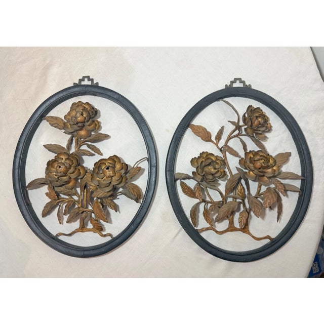 Up for sale is an exquisite pair of handmade antique Chinese gilt wrought iron and wooden flower wall sculptures. The...