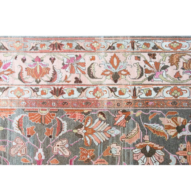 This antique Persian Mehraban rug, dating to circa 1920, features an elegant all-over floral design on a sophisticated...