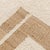 Natural jute and ivory wool rug. Features a bold symmetrical geometric design mixed with soothing airy neutral tones which...