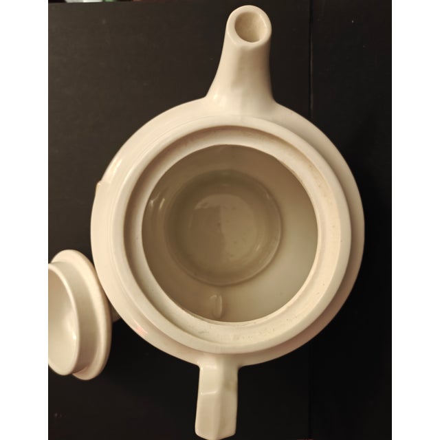 This charming piece of Americana is a classic 1930s - 1940s teapot from the renowned Porcelier company. Crafted in high-...