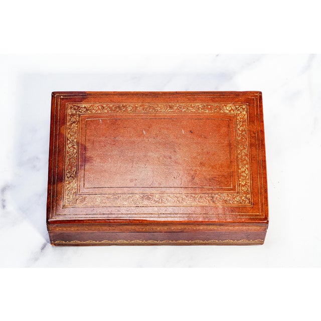 A refined blend of mid-century design and timeless craftsmanship, this vintage leather-covered wood box is a quietly...