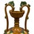 This vessel is a classic example of a Chinese Sancai-glazed double dragon-handled amphora. It is a high-quality...