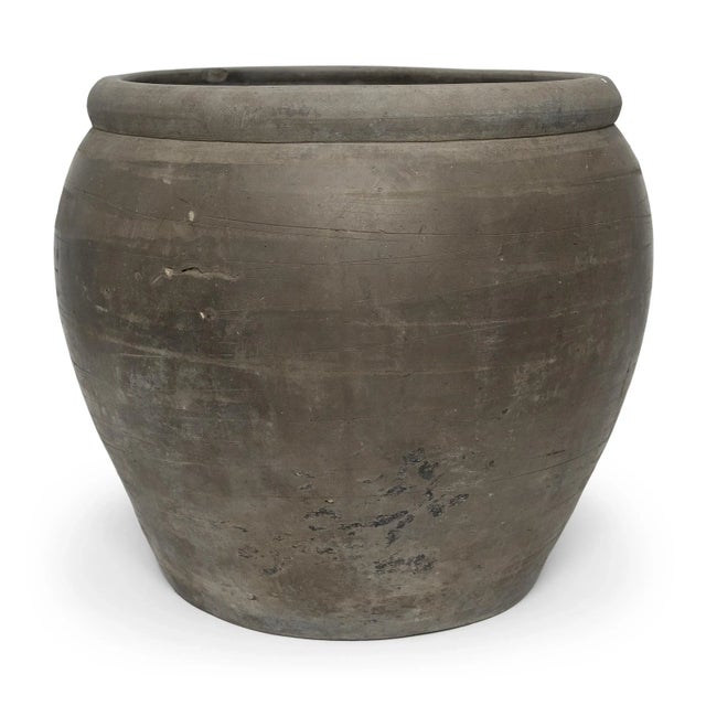 Sculpted by artisans in China's Shanxi province, this black clay vessel has a quiet simplicity, shaped with balanced...