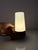 The Model 6080 wall lamp in brown by Sigvard Bernadotte for Ifö Electric is a classic of Swedish design. The angular base...
