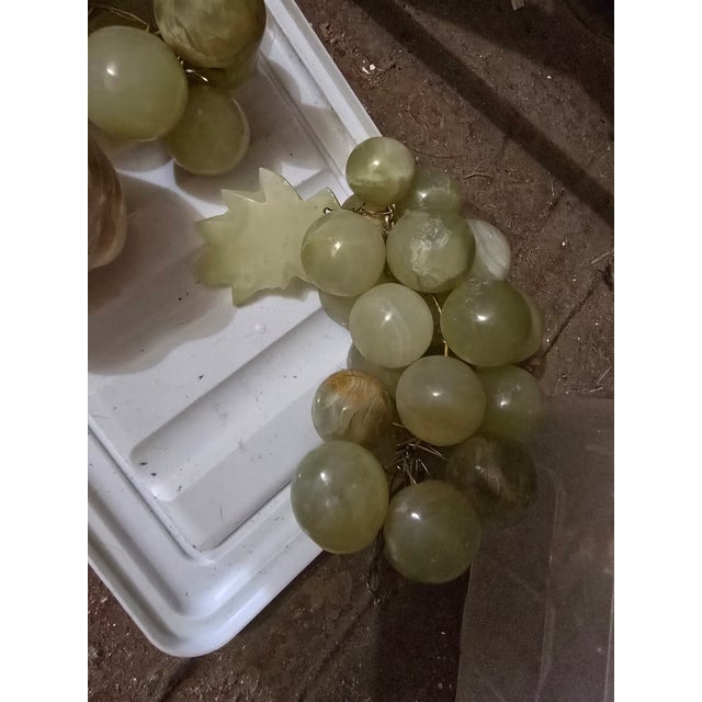 String of jade marbles in the image of a bunch of grapes