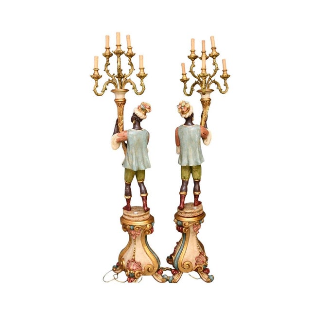 Transform your space with this breathtaking Italian figural standing candelabra floor lamp, a masterpiece of early 20th-...