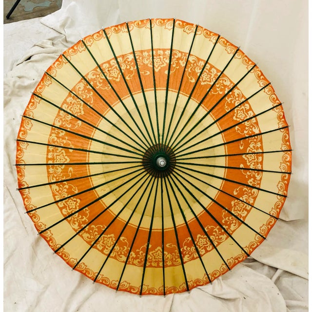 Stunning Vintage Asian Paper Parasol Umbrella. Fabulously colorful with electric blue wooden handle, red thread detail...