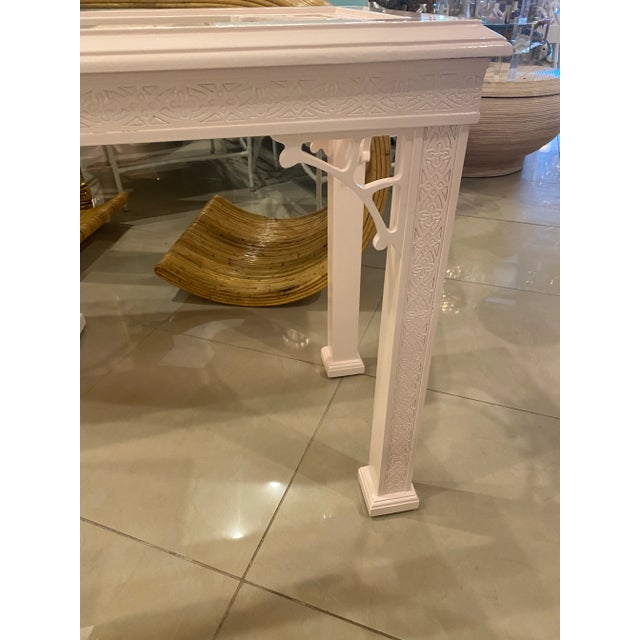 Such a beautiful faint coral, newly lacquered, console table. New glass top. Fretwork details on the legs, skirt, top and...
