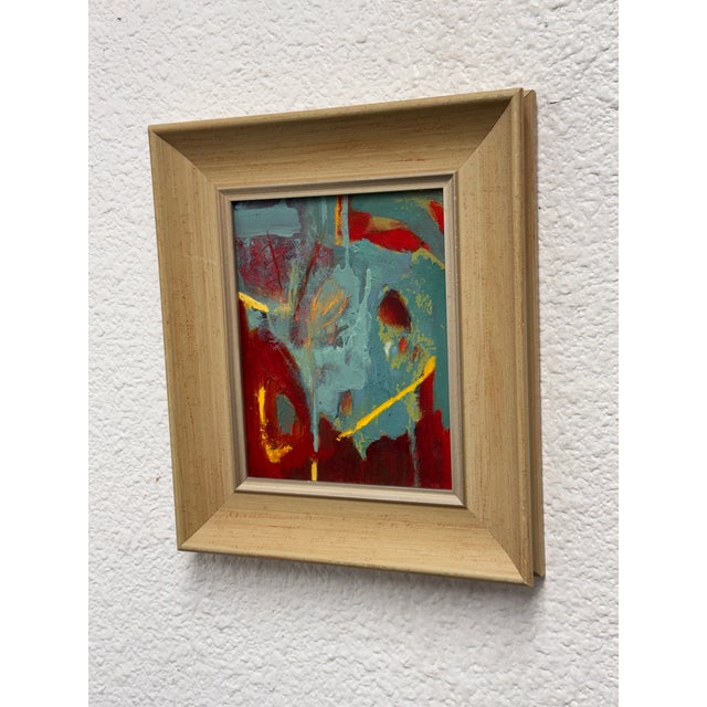 Design Plus Gallery presents a Framed Acrylic Abstract. Expressive layers of teal blue, crimson red, and golden yellow...