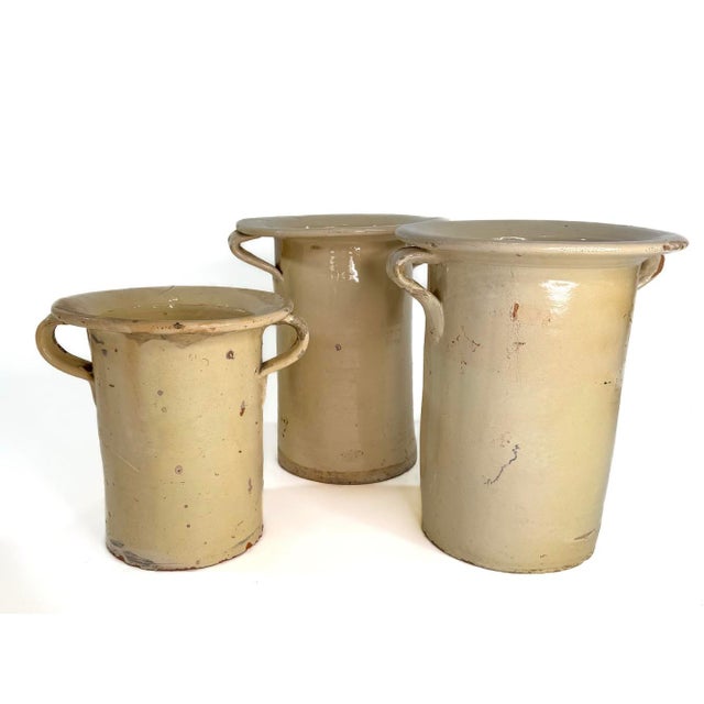 An authentic set of three 19th-Century Italian confit pots or jars. These pots are full of character, hand crafted and...