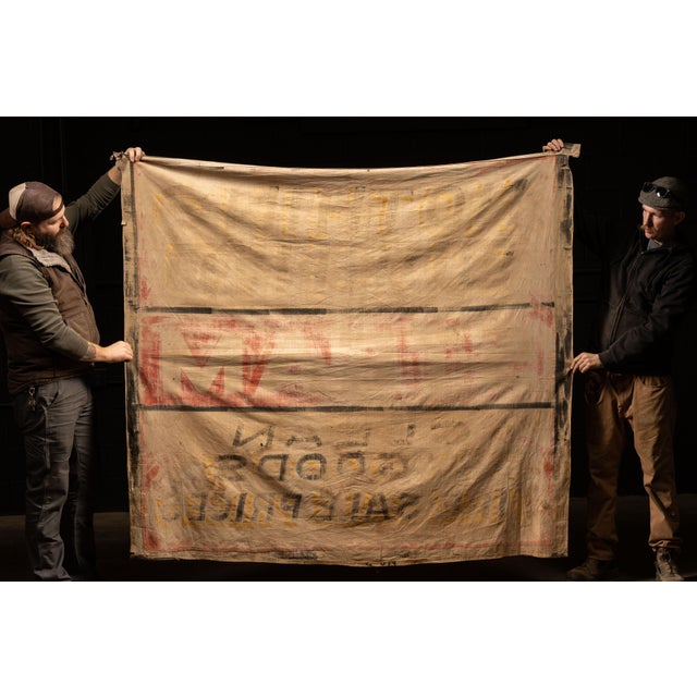 c. 1910s-1930s; Vintage hand‑painted storefront banner on heavy canvas reading "NOTHING BURNED / STEAM / CLEAN DRY GOODS /...