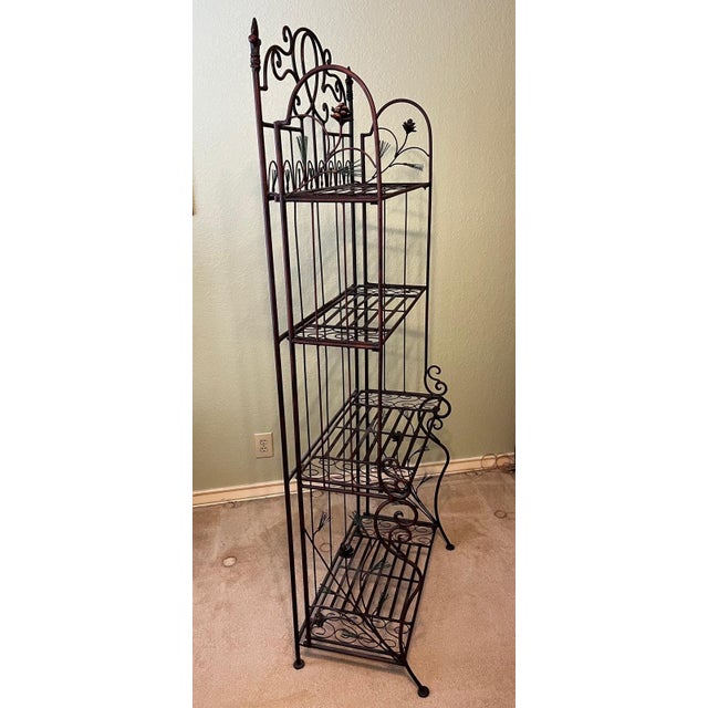 This is a large French baker's rack made of iron with 4 shelves and was used in a bakery in Bordeaux, France. It measures...