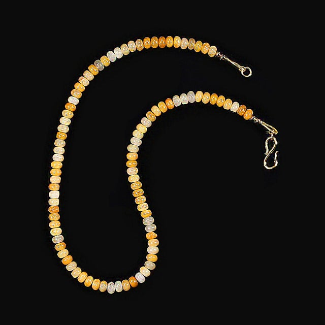 This 17‑inch natural yellow/gold aventurine necklace brings a warm, luminous glow to any jewelry collection. Each bead is...