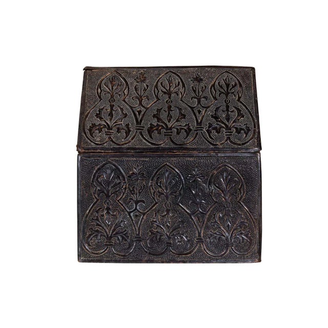 Leather covered box with nailhead detail and a domed lid.