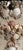 Wall panel embellished with shells and hand painted elements, on a textured base. Patina applied to replicate age.