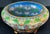 A large Chinese cloisonné bowl, about 14 inches across, covered in lotus blossoms and scrolling leaves in turquoise,...
