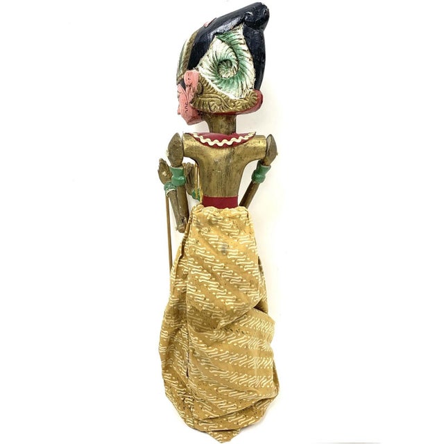 A pair of vintage Javanese Wayang Golek traditional Indonesian three dimensional rod puppets on wooden display stands with...