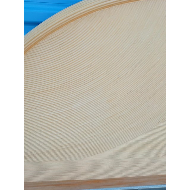 A beautiful vintage oval pencil reed queen size headboard. The headboard its in it's natural light pale color.