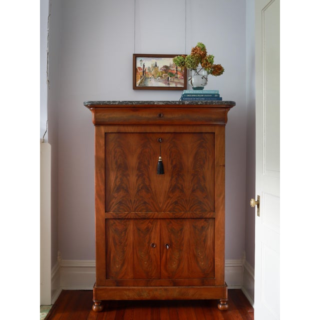 This handsome piece is a 19th century Louis Philippe Secretary, or in French, a secretaire à abattant. This secretary with...