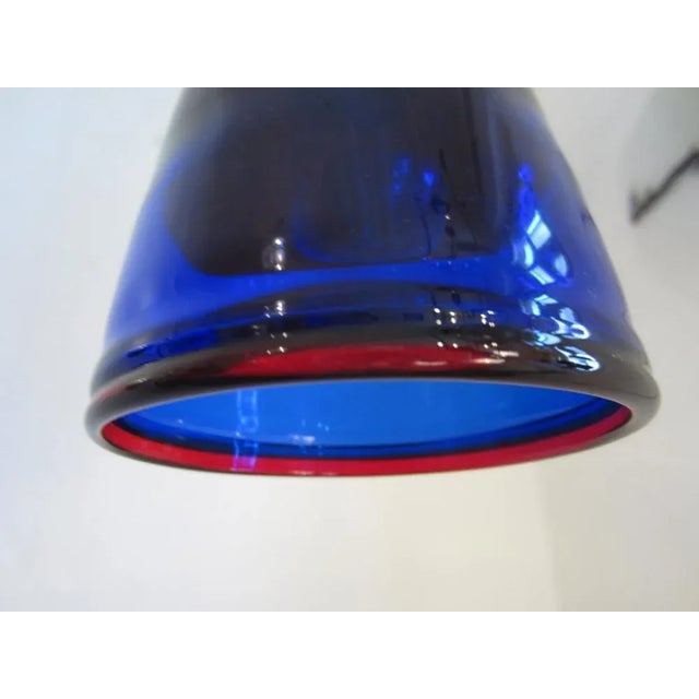 Intensely vibrant colors in blue and red, with its distinctive Italian design, make this small Murano ceiling lamp a real...