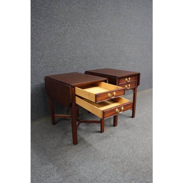 Pair of mahogany Pembroke-style drop leaf end tables by Henkel Harris for Virginia Galleries, Winchester, Virginia. Each...