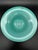 Blown glass bowl by Venini. The material is opaline glass. The color is aqua blue. It has the original circular mark to...