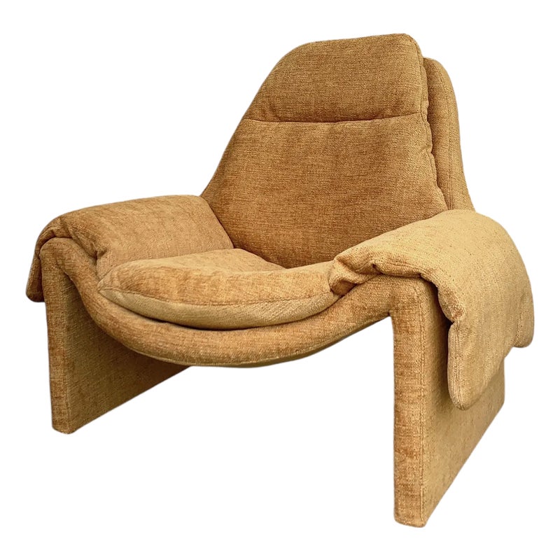 Tan upholstered chair with cushioned seat and backrest