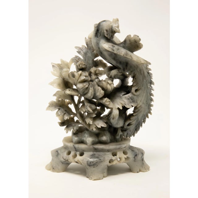 Offering this stunning hand carved soapstone featuring a phoenix. Starting on the base with four legs on an oblong base....