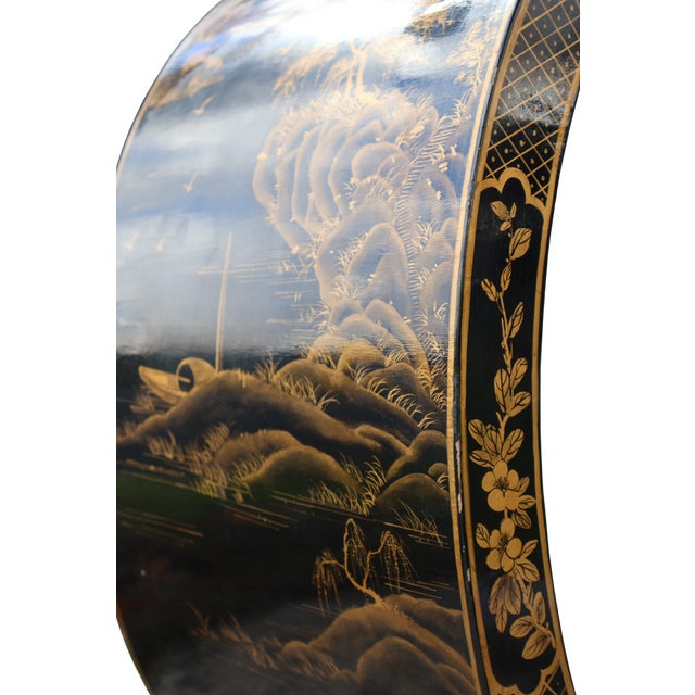 A sculptural chinoiserie console distinguished by sweeping C-scroll supports, a pierced geometric apron, and elaborate...