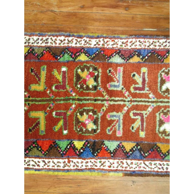 Colorful midcentury narrow and long Turkish Anatolian runner. Orange field with lime green, turquoise, hot pink and blue...