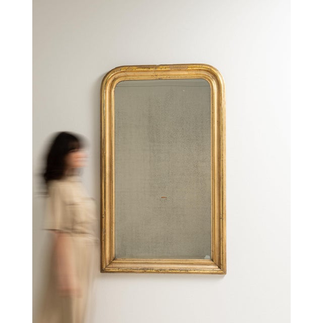 This mirror makes its impression through gold gilt textured, worn patina. The piece dates to 1880s, sourced from France,...