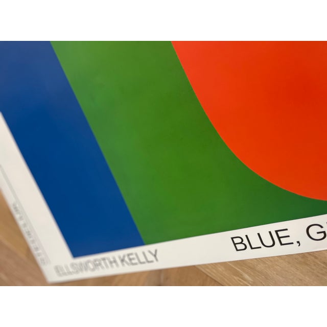 This striking exhibition poster features Ellsworth Kelly’s iconic work Blue, Green, Red I (1964-65), exemplifying his...