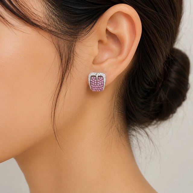 14K white gold earrings featuring 96 natural pink sapphires (1.99 ct) and 62 brilliant diamonds (0.50 ct) in a buckle-...