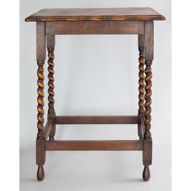 A superb antique early 20th-Century English Edwardian tiger oak rectangular barley twist side table, circa 1910. This fine...