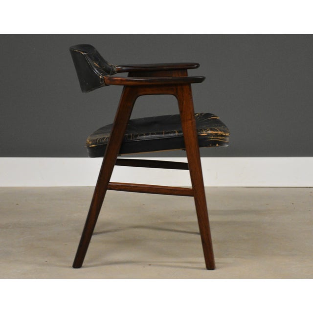 A mid century modern rosewood dining arm chair designed by Erik Kirkegaard. Made in Denmark. Original beautiful black...