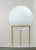 The OPALA vase is composed of a white opaline murano glass bowl, the element is inserted in a solid brass tripod base. The...
