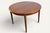 Beautiful Danish teak dining table from the 1960s. Its round top extends with two leaves, creating a comfortable oval...