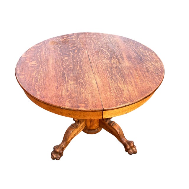 Antique Quarter-Sawn Oak Griffin Pedestal Table An impressive antique pedestal table crafted from richly figured quarter-...