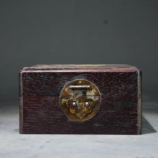 This elegant vintage wooden box is a beautiful example of traditional Chinese craftsmanship. Crafted from dense, dark...
