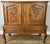 This elegant Vintage French Louis sideboard cabinet showcases beautifully carved oak doors, graceful cabriole legs, and...