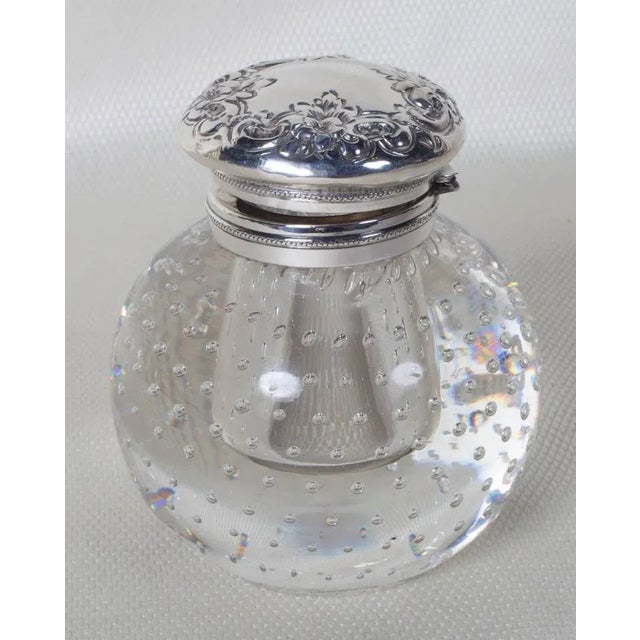 Pairpoint ball shaped inkwell with the controlled bubble pattern that became synonymous with the company. The glass was...