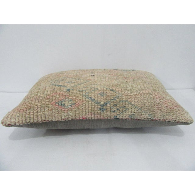 Decorative pillow cover made from a vintage Turkish handknotted rug. Backed with good quality cotton fabric. Pillow...