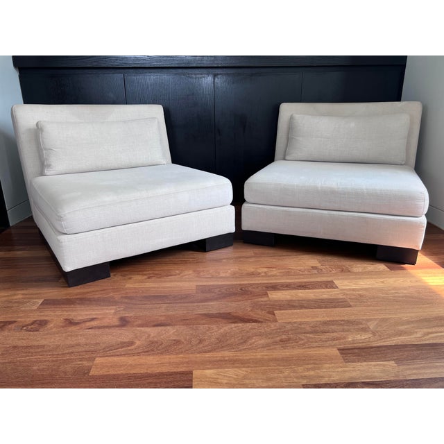 Beautiful pair of slipper chairs from the early debut era of the Armani/Casa collection. Designed by Italian designer...