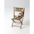 This vintage children’s folding chair features a classic wood frame with a green cotton seat and backrest, accented by...