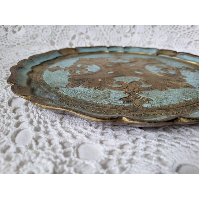 A vintage Italian Florentine turquoise and gold gilt round tray, made in Italy. This beauty can be used as a decorative...
